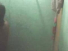 Telugu bhabhi in shower opening her blouse getting naked for shower recorded by hidden cam fixed in her toilet by neighour.